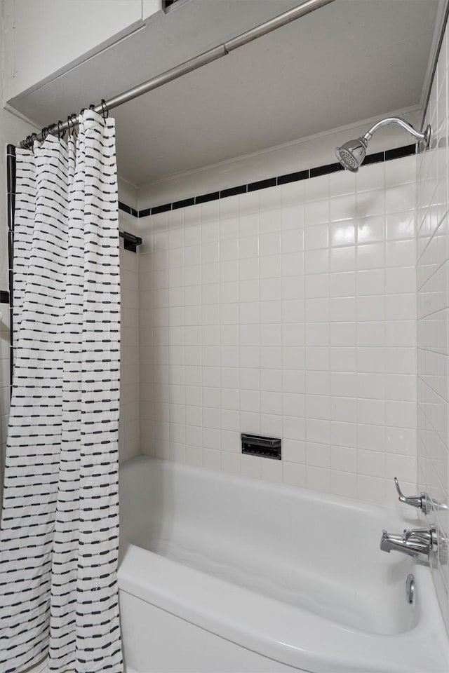 bathroom featuring shower / bath combination with curtain