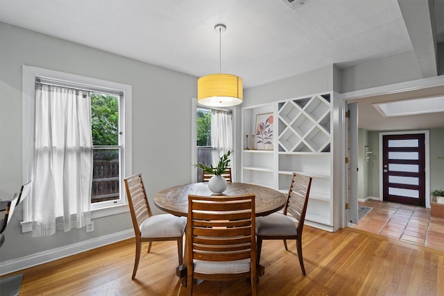 dining area featuring hardwood / wood-style flooring