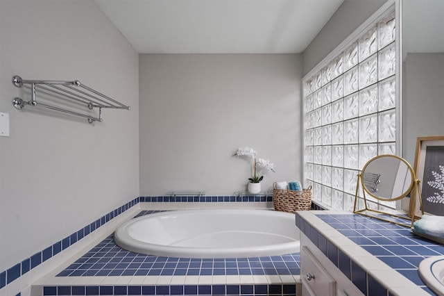 bathroom with tiled tub