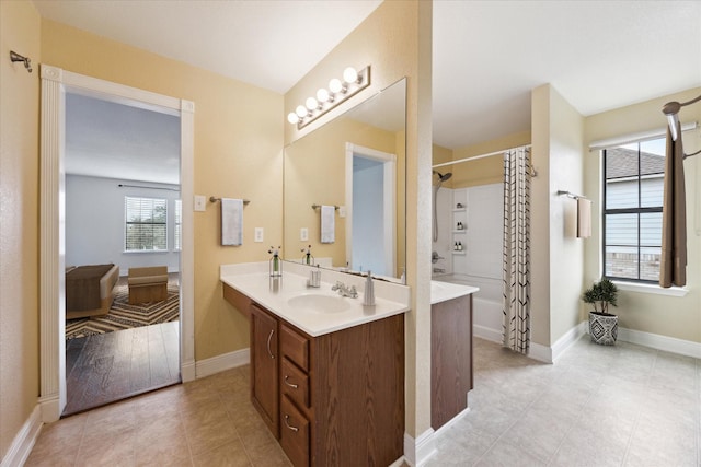 bathroom featuring vanity, shower / tub combo, and tile patterned flooring