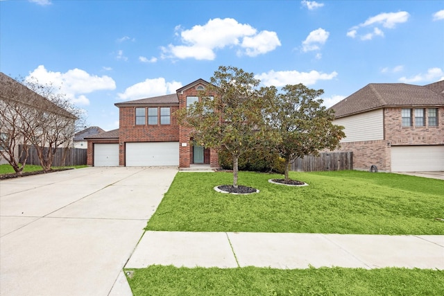 view of property with a front yard and a garage