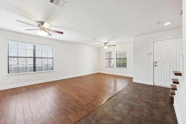 interior space with dark hardwood / wood-style floors and ceiling fan