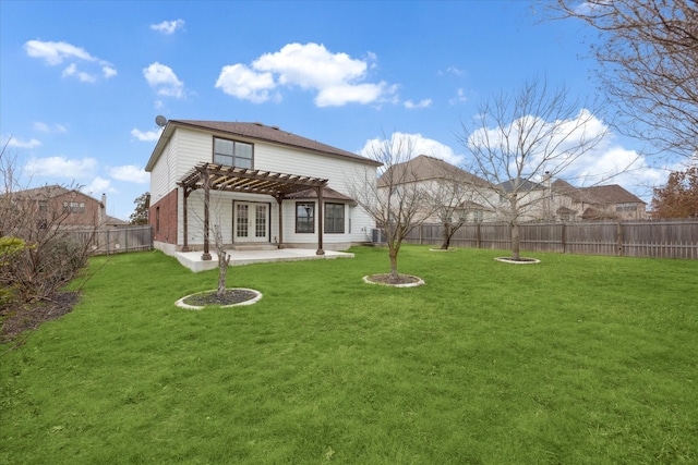 rear view of property with central AC unit, a yard, a pergola, and a patio