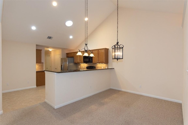 kitchen featuring high vaulted ceiling, decorative backsplash, light carpet, stainless steel fridge with ice dispenser, and decorative light fixtures