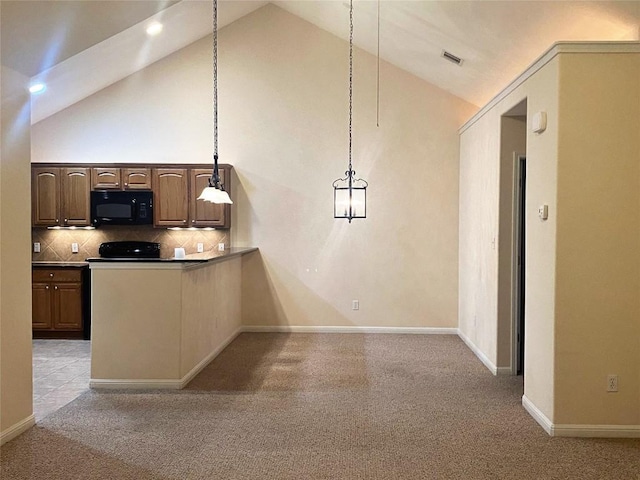 kitchen featuring tasteful backsplash, decorative light fixtures, high vaulted ceiling, and light carpet