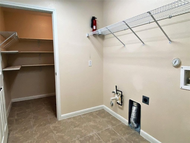 laundry area with hookup for a washing machine, gas dryer hookup, and hookup for an electric dryer