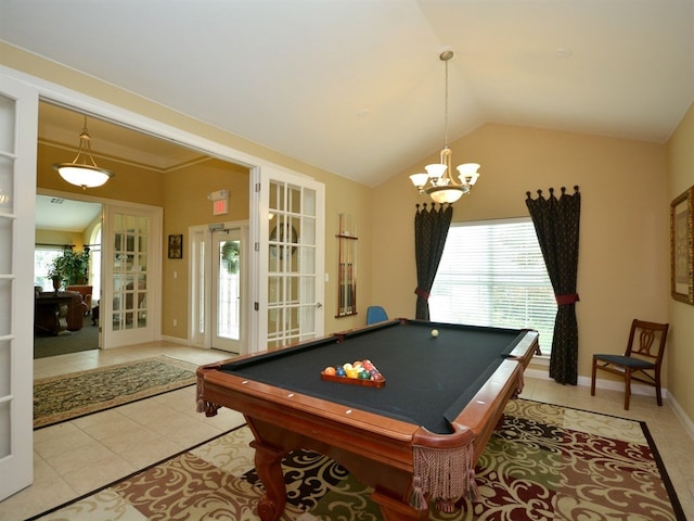 playroom featuring vaulted ceiling, a healthy amount of sunlight, and light tile patterned floors