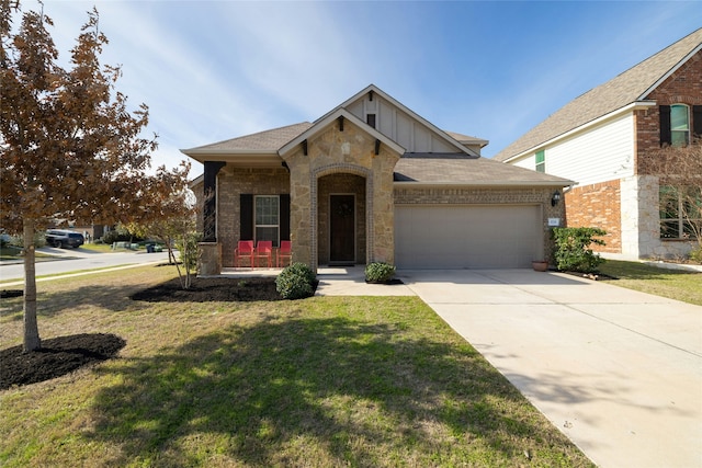 view of front of house featuring a garage, covered porch, and a front lawn