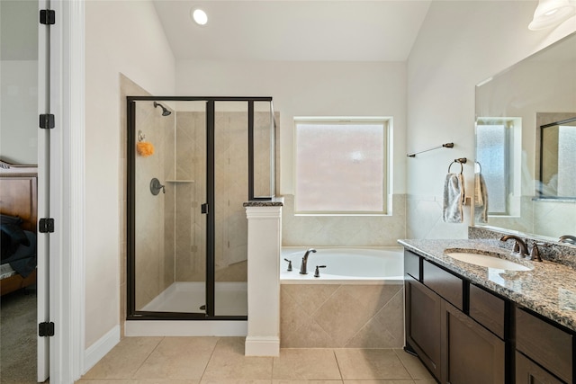 bathroom featuring vanity, separate shower and tub, and tile patterned flooring