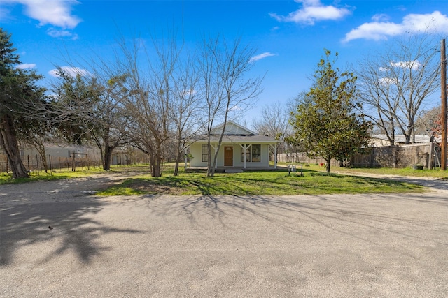 view of front of home featuring a front lawn and a porch