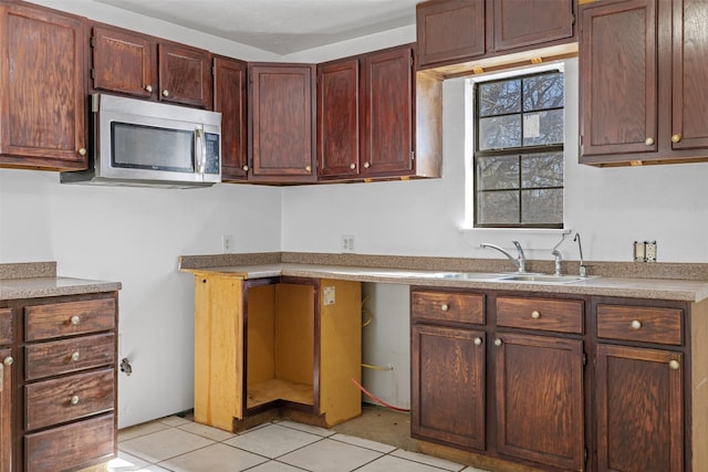 kitchen with sink and light tile patterned floors