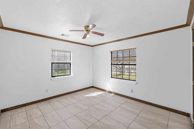 spare room with ceiling fan, light tile patterned floors, and ornamental molding