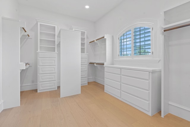 spacious closet featuring light hardwood / wood-style floors