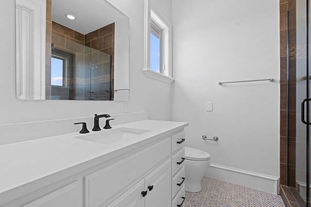 bathroom featuring toilet, tile patterned flooring, an enclosed shower, and vanity