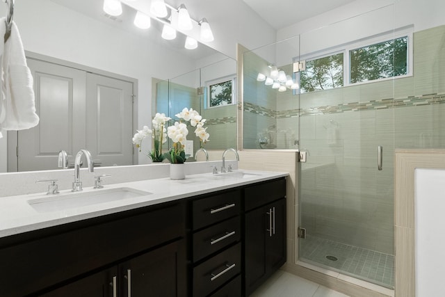 bathroom featuring vanity, walk in shower, and tile patterned floors