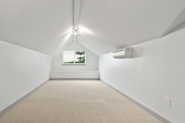 bonus room with light carpet, vaulted ceiling with beams, and a wall unit AC