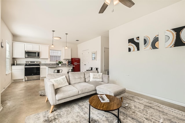 living room with ceiling fan