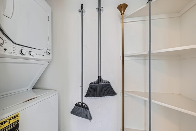 laundry room featuring stacked washer and dryer