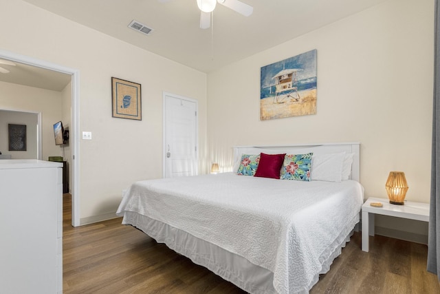 bedroom with ceiling fan and hardwood / wood-style floors