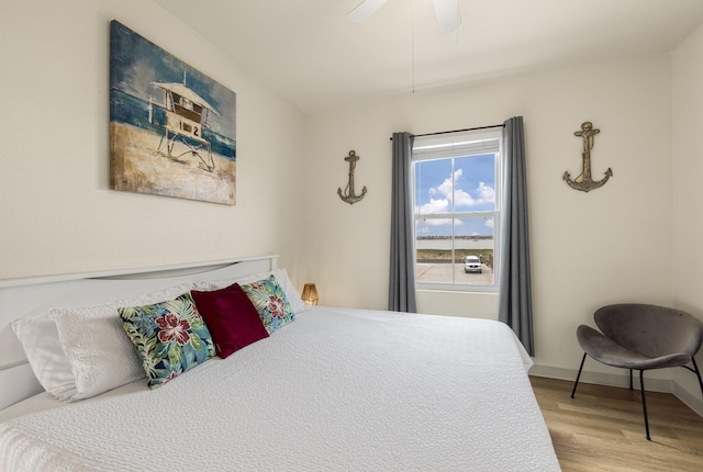 bedroom featuring light wood-type flooring and ceiling fan