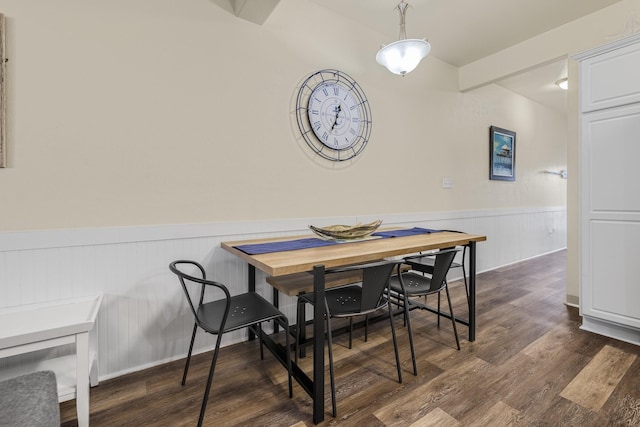 dining room with dark hardwood / wood-style flooring