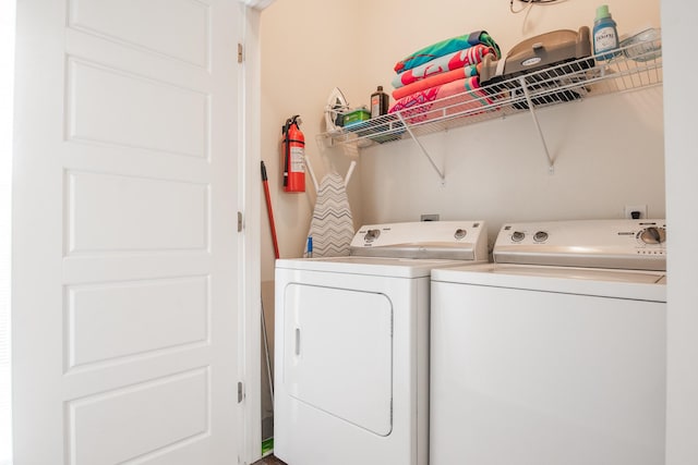 washroom featuring independent washer and dryer