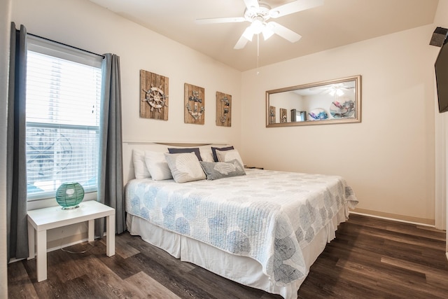 bedroom featuring ceiling fan and dark hardwood / wood-style floors