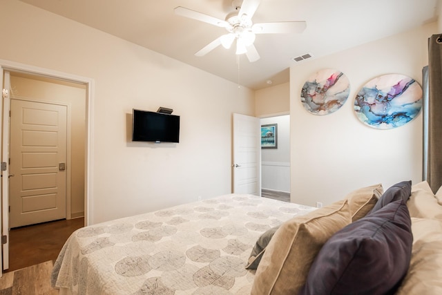 bedroom featuring dark hardwood / wood-style floors and ceiling fan