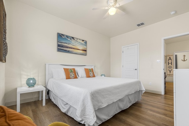 bedroom with ceiling fan and dark hardwood / wood-style floors