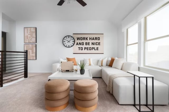 carpeted living room featuring ceiling fan