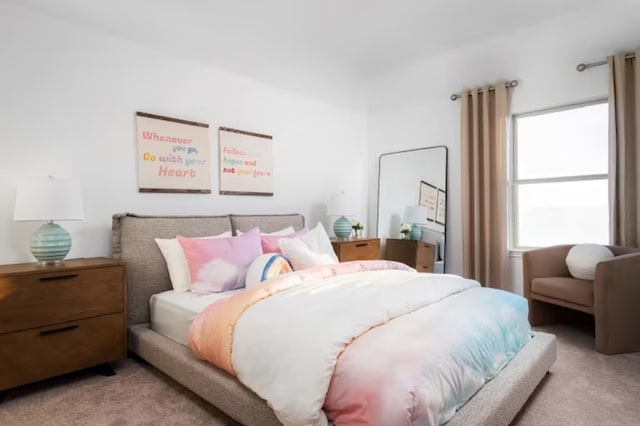 bedroom with light carpet