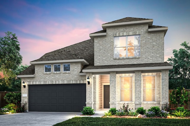 view of front of property with a garage