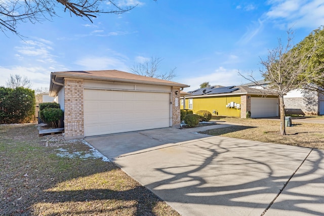 view of front of property with a garage and an outbuilding