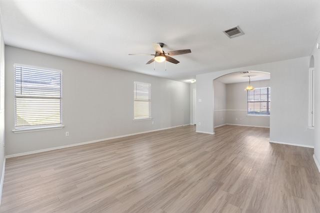 spare room featuring ceiling fan and light wood-type flooring