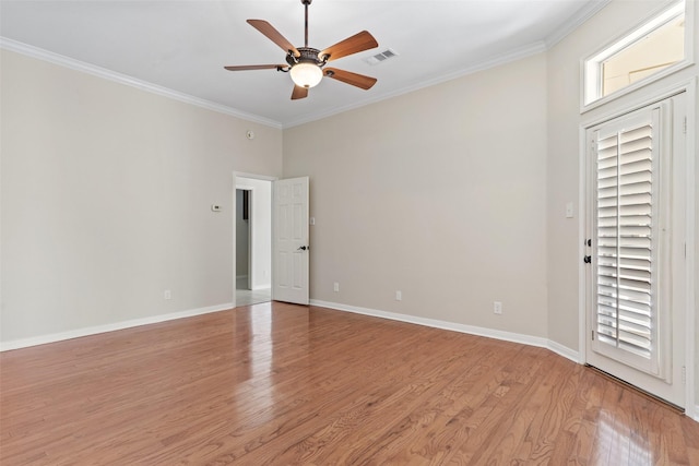 spare room with ceiling fan, ornamental molding, and light hardwood / wood-style floors