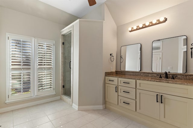 bathroom featuring vanity, ceiling fan, walk in shower, and tile patterned floors