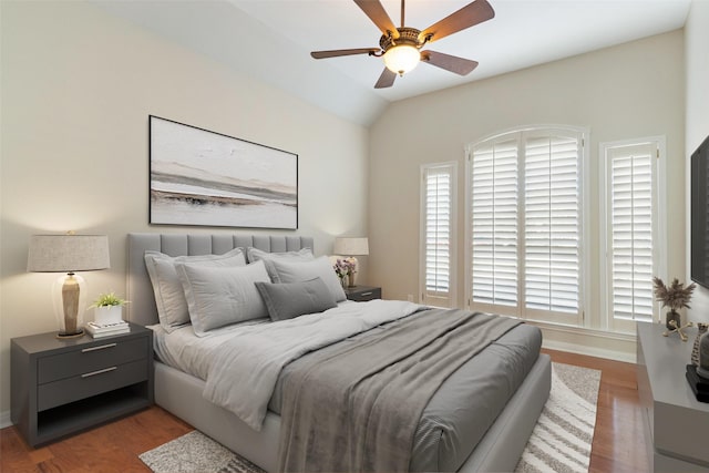 bedroom with lofted ceiling, light hardwood / wood-style floors, and ceiling fan