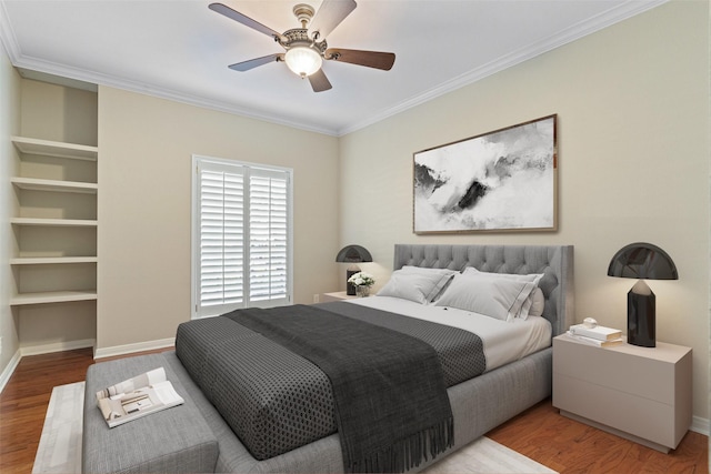 bedroom with crown molding, light hardwood / wood-style flooring, and ceiling fan