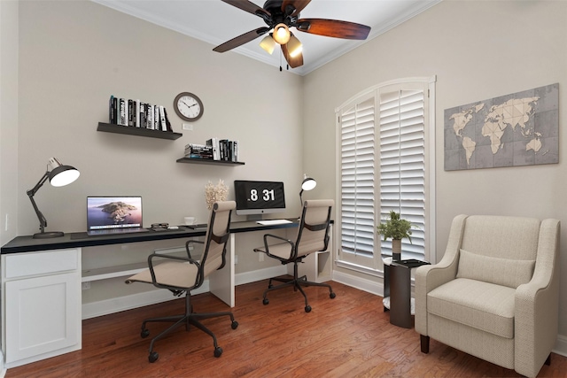 office space featuring crown molding, wood-type flooring, and ceiling fan