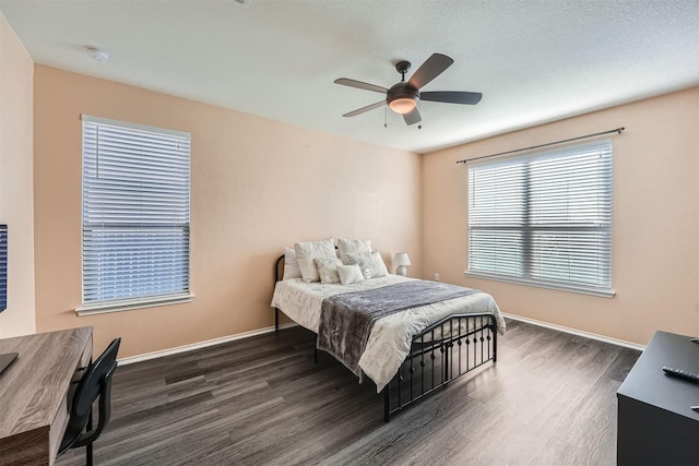 bedroom featuring ceiling fan and dark wood-type flooring