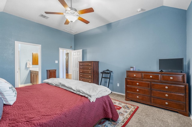 carpeted bedroom with ceiling fan, connected bathroom, and vaulted ceiling