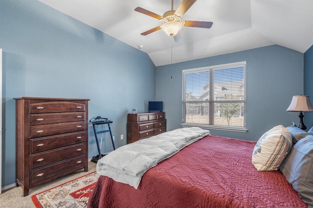 bedroom featuring lofted ceiling, light carpet, and ceiling fan