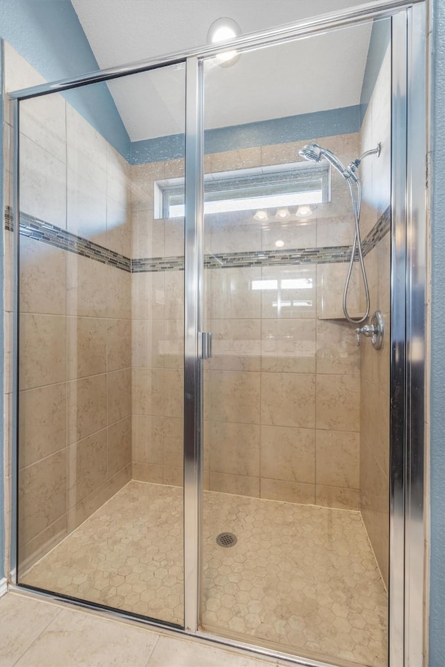 bathroom featuring tile patterned floors and walk in shower