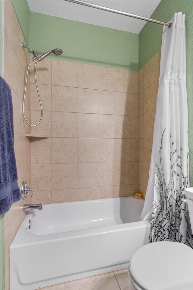 bathroom with shower / bath combination with curtain, toilet, and tile patterned flooring