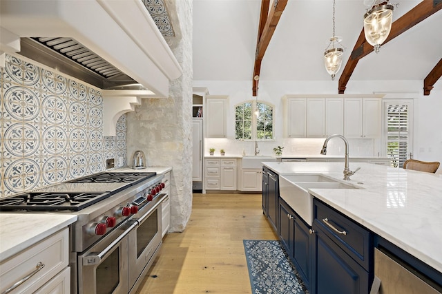 kitchen featuring white cabinetry, range with two ovens, blue cabinetry, sink, and beam ceiling