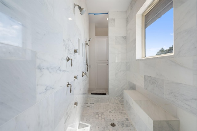 bathroom featuring a tile shower