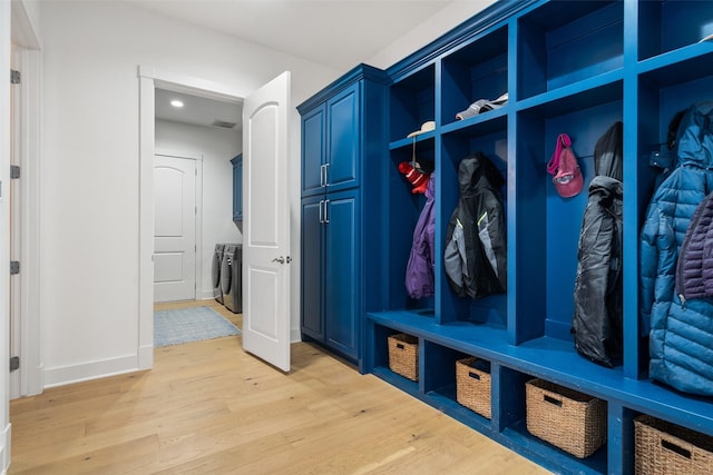 mudroom featuring washer / dryer and light hardwood / wood-style flooring