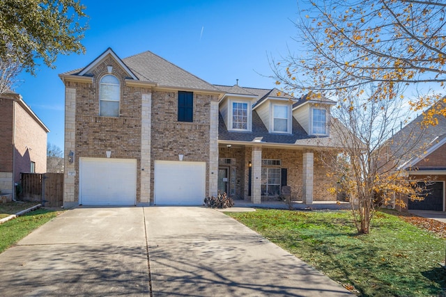 view of front facade with a garage and a front lawn