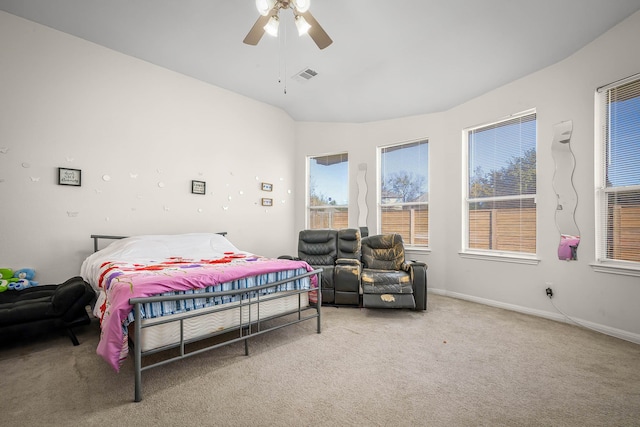 bedroom with ceiling fan, carpet, and vaulted ceiling