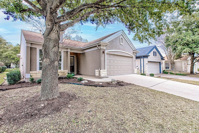 ranch-style home featuring a garage